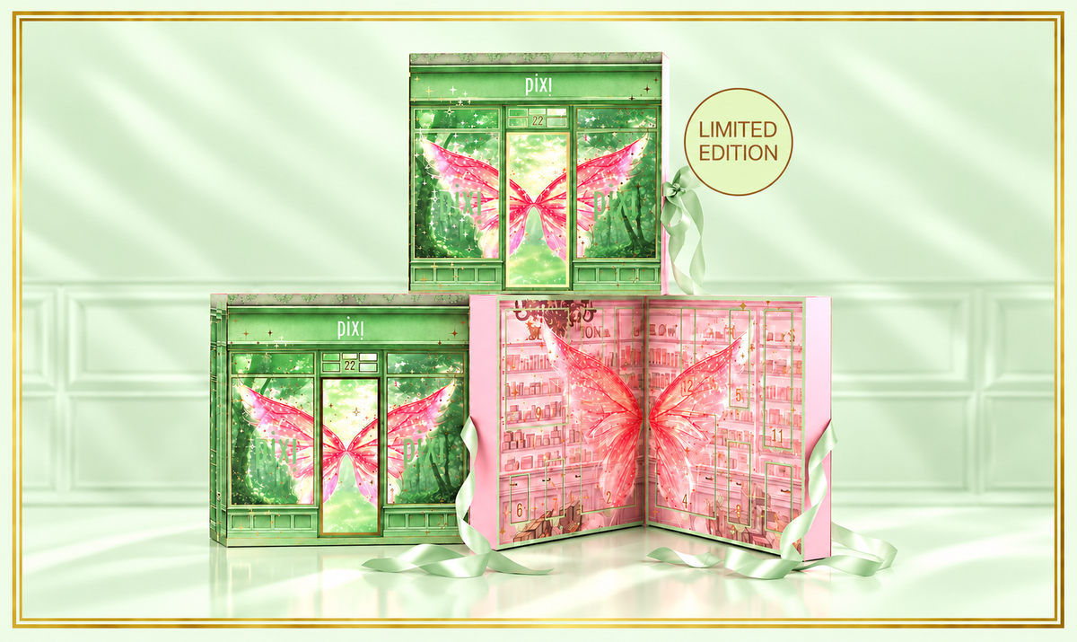 Three Pixi 'Limited Edition' advent calendar boxes arranged on a glossy surface against a pale mint green tiled background. One box is closed, showing green artwork with pink butterfly wings, and two boxes are open to reveal pink-toned inner packaging with butterfly graphics. View 2