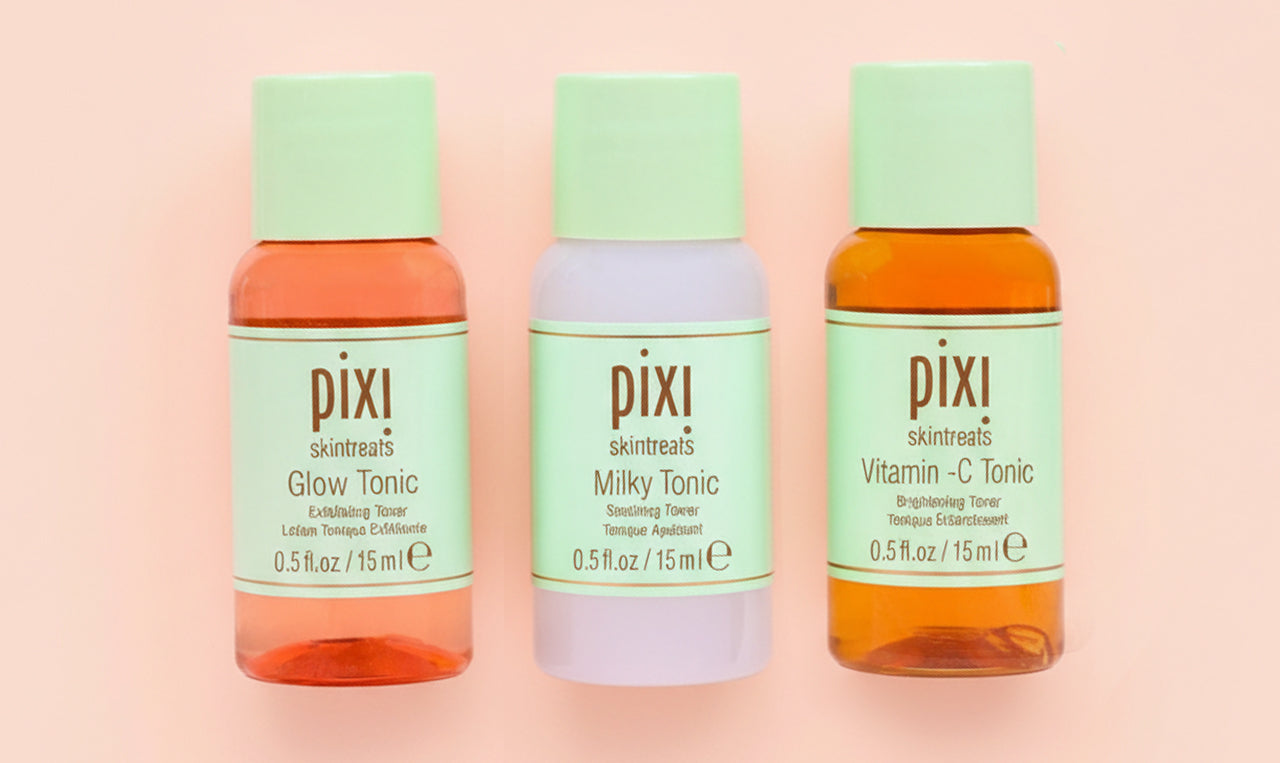 Mini Glow Tonic, Milky Tonic and Vitamin-C Tonic on orange background