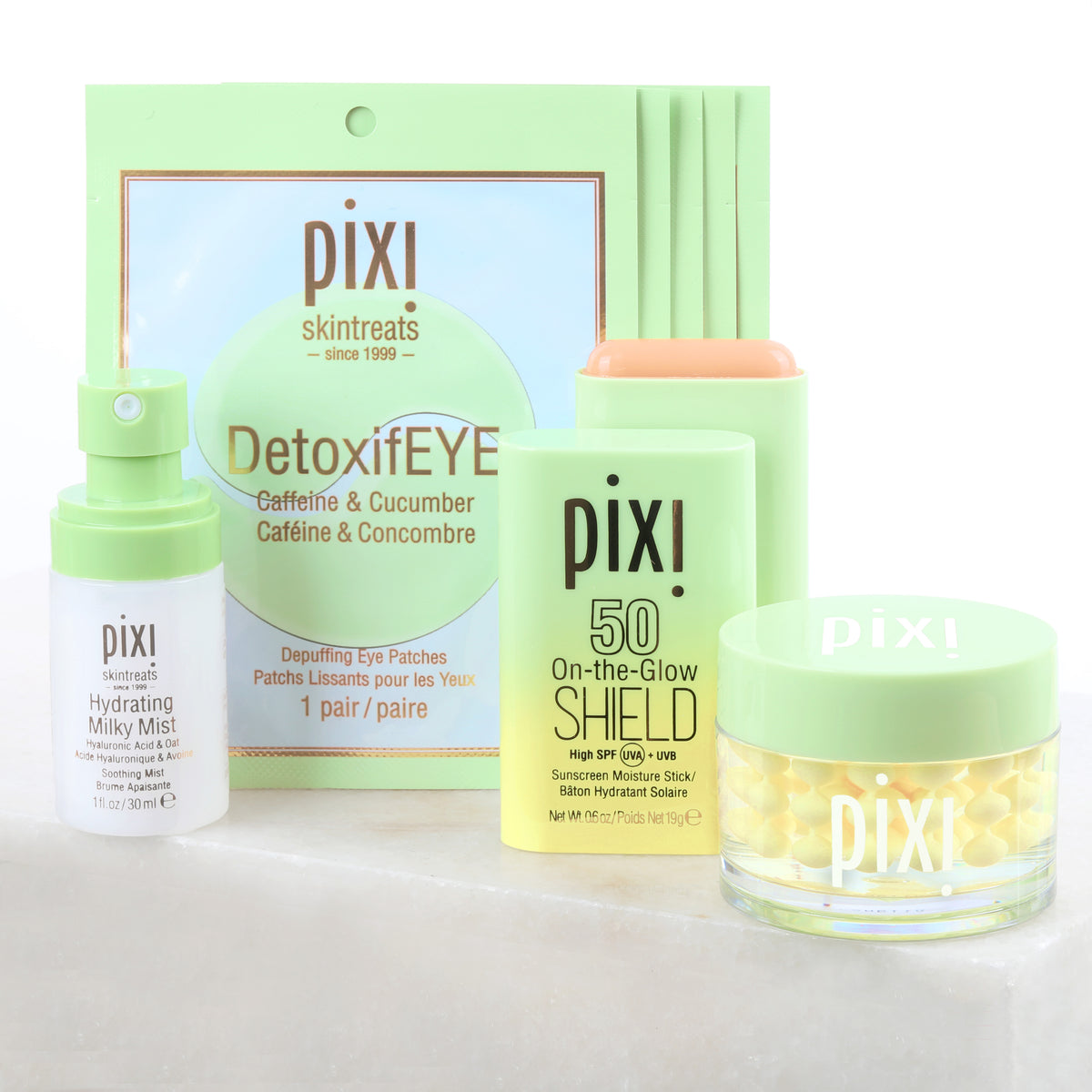 Petra's Travel Glow bundle includes Hydrating Milky Mist, DetoxifEYE Depuffing Eye Patches 5 pair, On-the-Glow SHIELD SPF 50, Vitamin-C CremeSerum on white background.