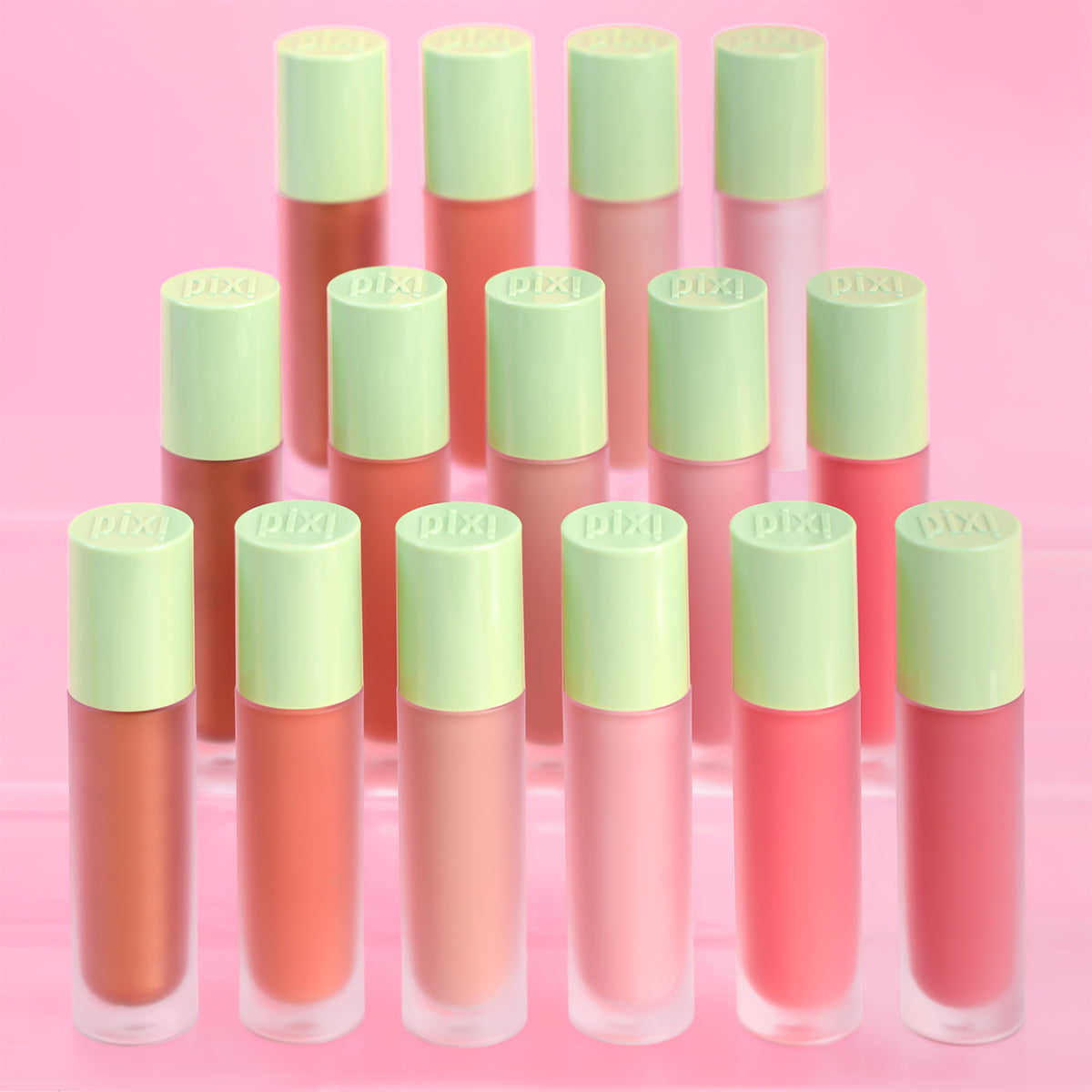 Set of LiquidGlow blush with green caps on a pink background
