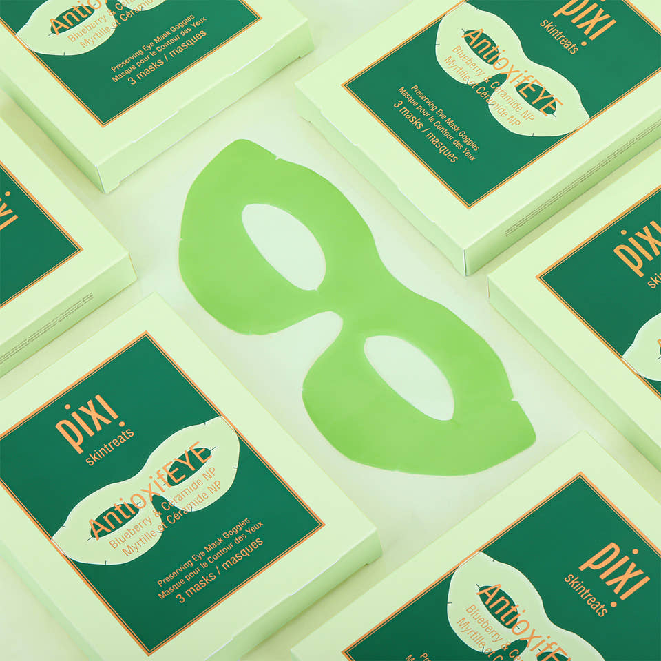 Multiple boxes of Pixi Beauty eye masks on a light green background view 2